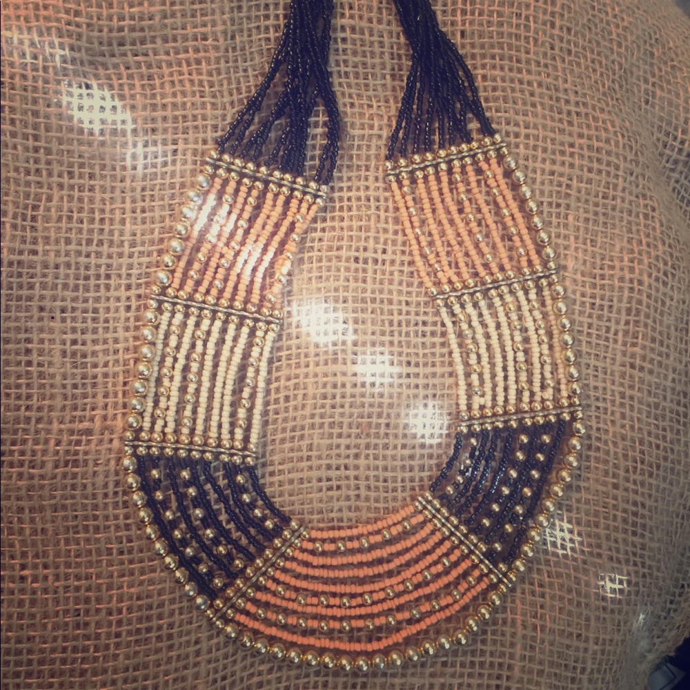 Peach, ivory, black, and gold. Beaded necklace.